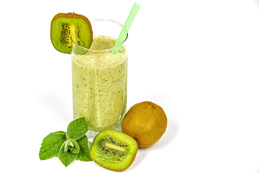 Fresh Kiwi Smoothie with Mint Garnish on White Background