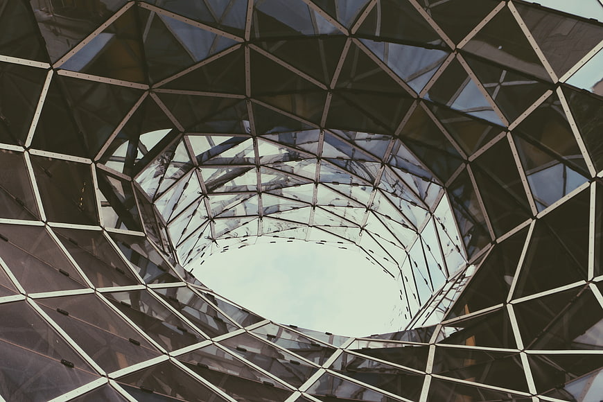 Abstract geometric glass dome architecture looking up