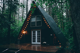 Cozy A-Frame Cabin in Forest with String Lights