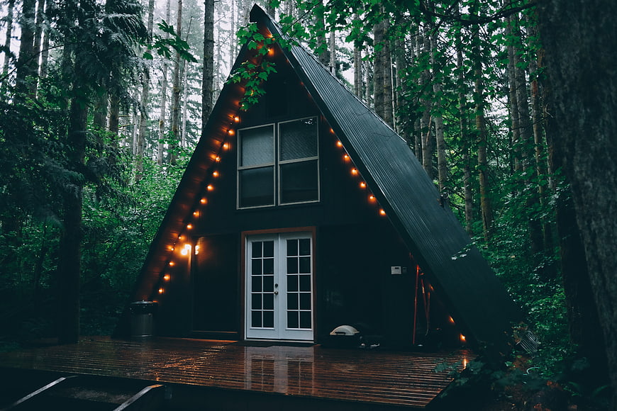 Cozy A-Frame Cabin in Forest with String Lights