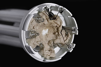 Close-up of CFL lightbulb base with internal components