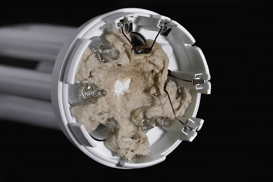 Close-up of CFL lightbulb base with internal components