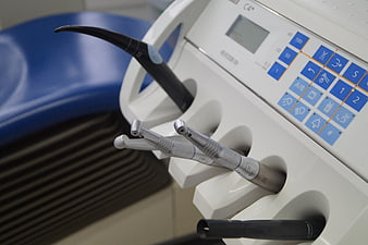 Dental Handpieces And Control Panel In Modern Clinic