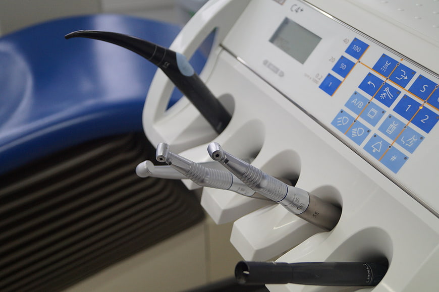 Dental Handpieces And Control Panel In Modern Clinic