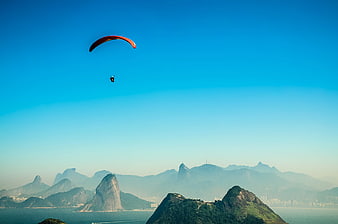Paraglider Flying Over Sugarloaf Mountain in Rio de Janeiro