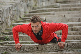 Athletic Man Doing Push-Ups on Outdoor Stone Stairs