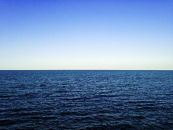 Serene Blue Ocean Horizon with Clear Sky
