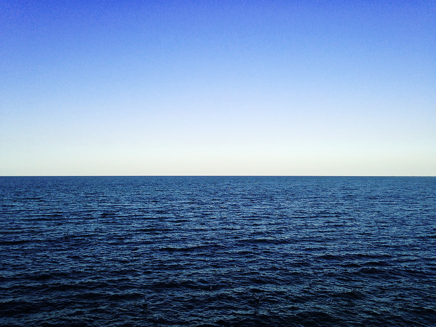 Serene Blue Ocean Horizon with Clear Sky