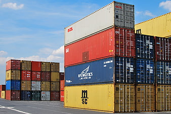 Stacked Shipping Containers in Logistics Port Yard