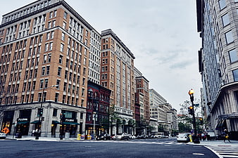 Wide angle urban street view with brick buildings and traffic