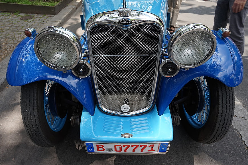 Front view of vintage blue Singer car with chrome grille