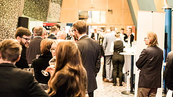 Business professionals networking at a corporate conference event