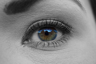 Close-up of Woman's Eye with Colorful Iris in Grayscale