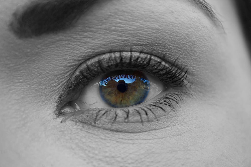 Close-up of Woman's Eye with Colorful Iris in Grayscale