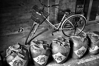 Black and white bicycle with traditional sake jars