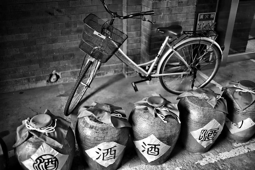 Black and white bicycle with traditional sake jars