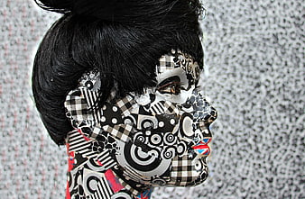 Artistic Portrait of Woman with Black and White Patterned Face Paint