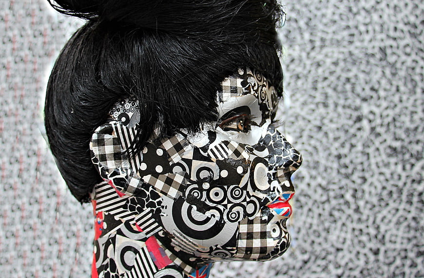 Artistic Portrait of Woman with Black and White Patterned Face Paint