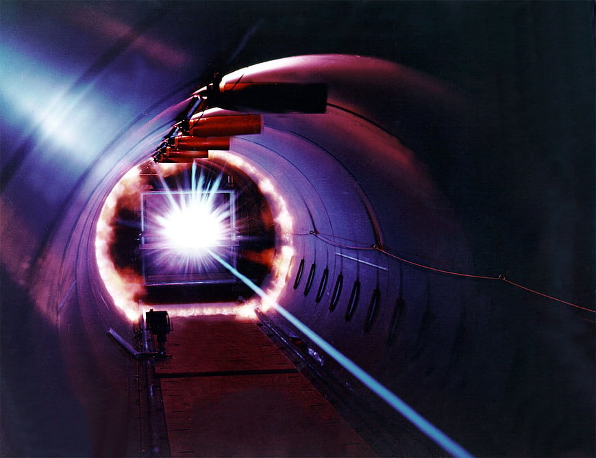 High-energy laser beam inside a scientific research tunnel