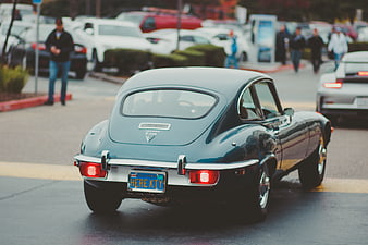 Rear view of classic blue Jaguar E-Type sports car