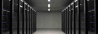 Modern server room with rows of black racks and blue lights