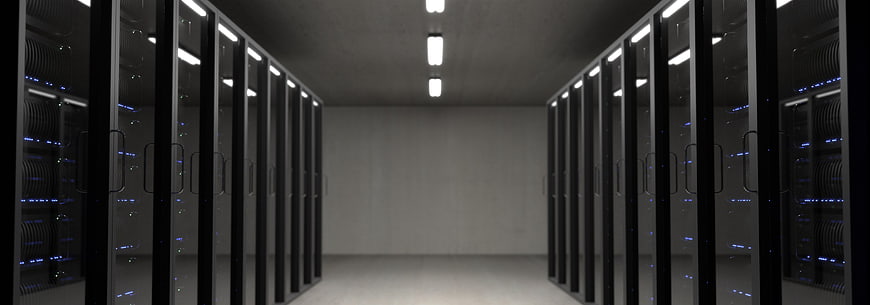 Modern server room with rows of black racks and blue lights
