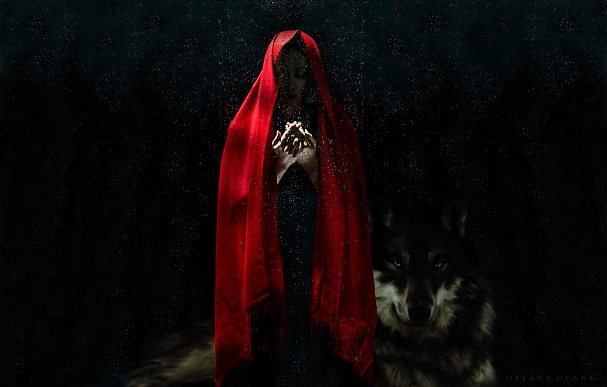Mysterious woman in red hood with wolf in dark fantasy setting