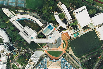 Aerial view of modern school campus with sports fields