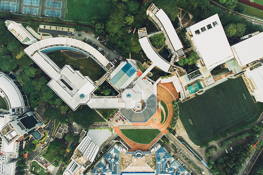 Aerial view of modern school campus with sports fields
