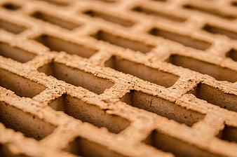 Close-up texture of stacked clay construction bricks