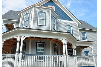 Gray and Blue Victorian House with White Porch