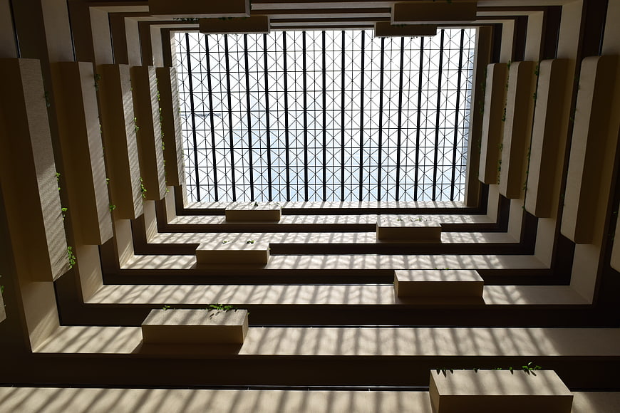 Modern architectural atrium with geometric skylight and shadows