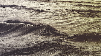 Dramatic Sepia Ocean Waves with Textured Water Surface