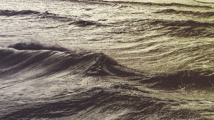 Dramatic Sepia Ocean Waves with Textured Water Surface