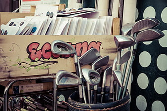 Used Golf Clubs in Bucket at Flea Market Stall