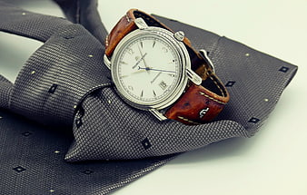 Elegant Silver Watch on Textured Grey Tie