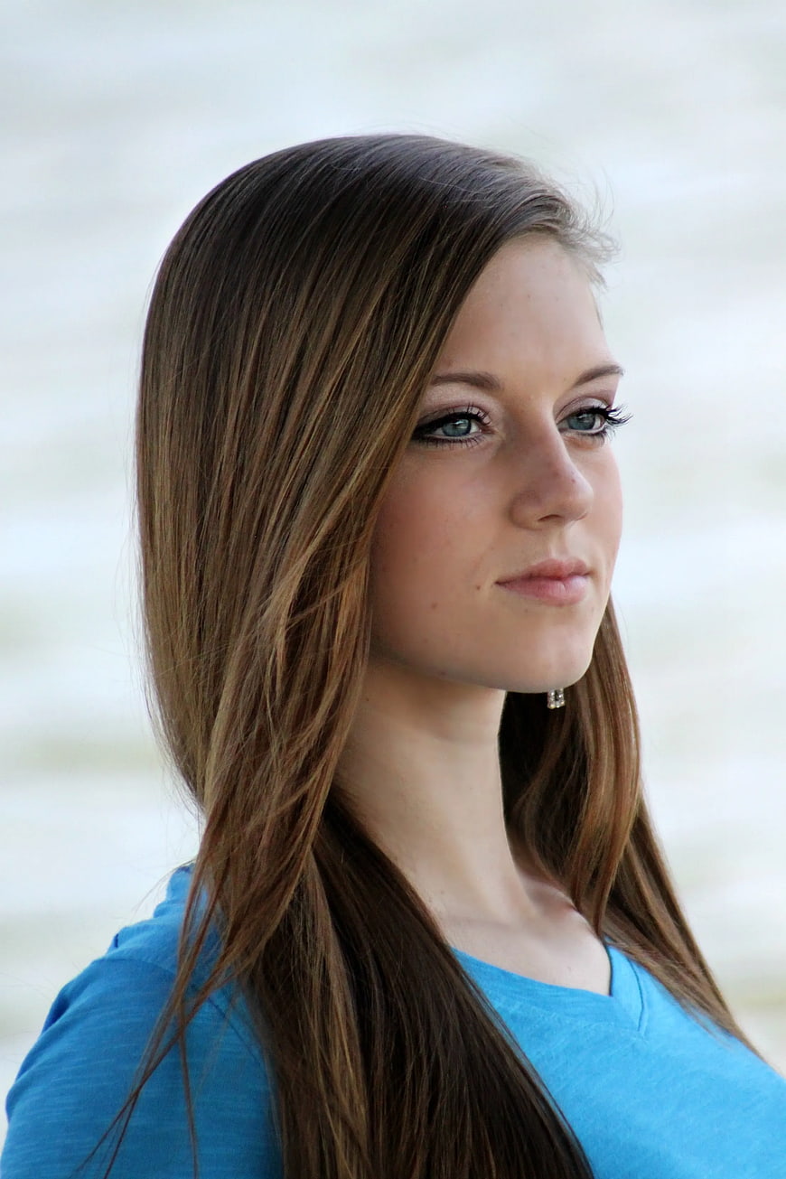 Portrait of young woman with blue eyes and brown hair