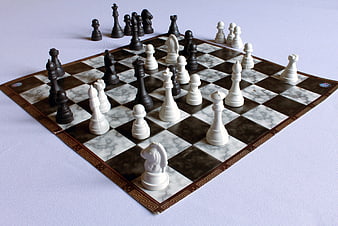 Marble Chess Board With Black And White Pieces In Mid-Game