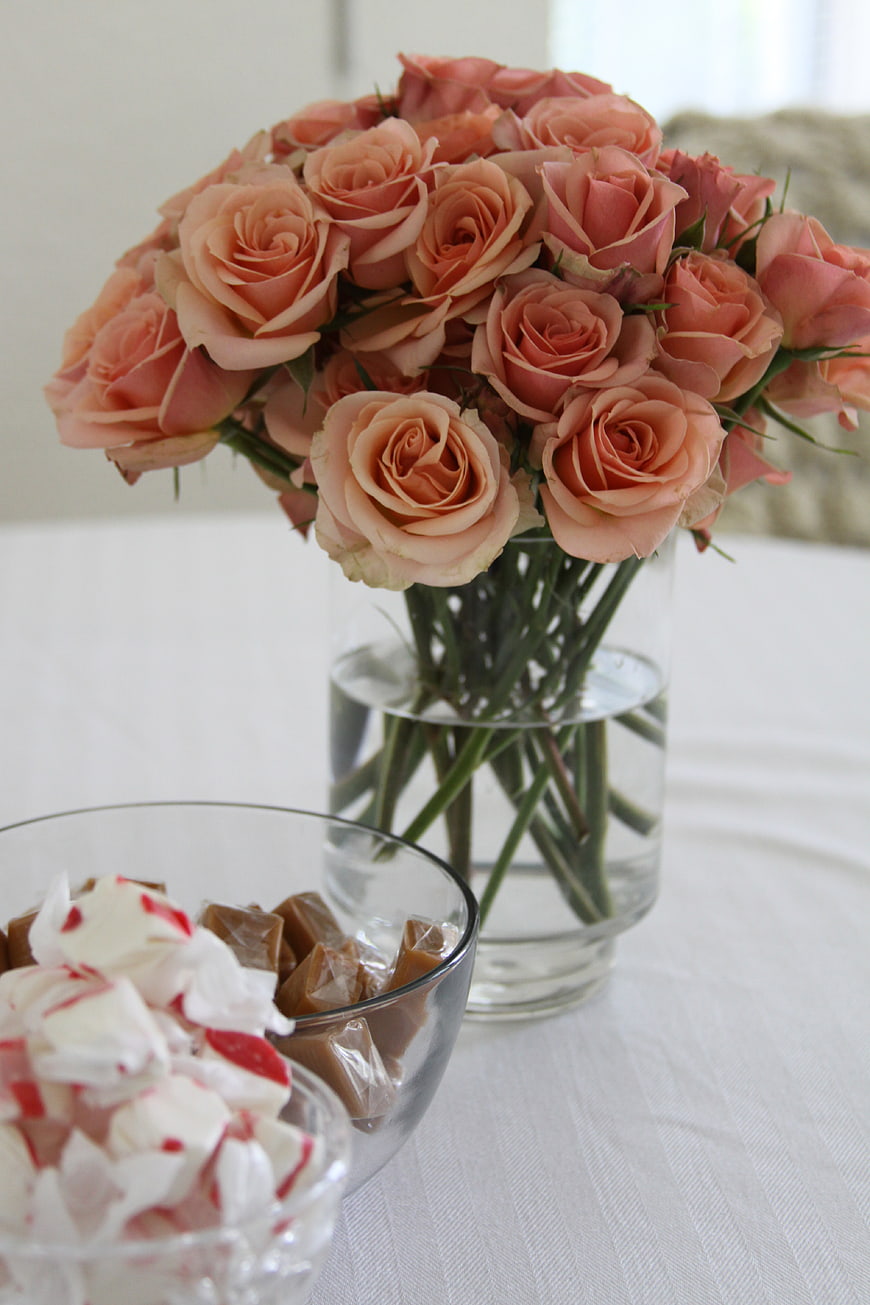 Pink Roses in Glass Vase with Candy Bowls