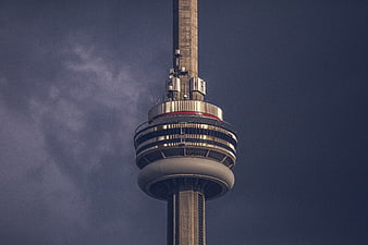 CN Tower observation deck against dark stormy sky
