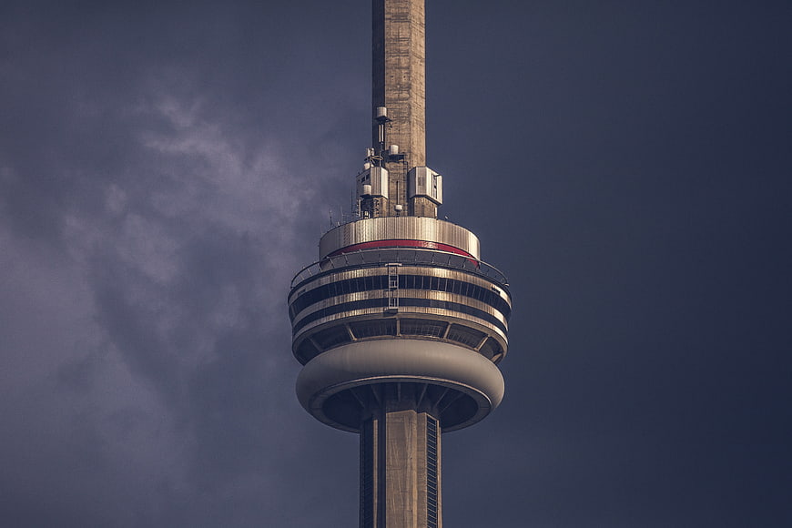 CN Tower observation deck against dark stormy sky
