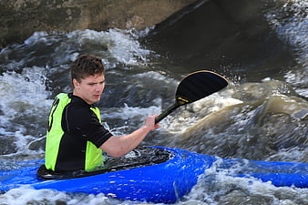 Man kayaking in whitewater rapids