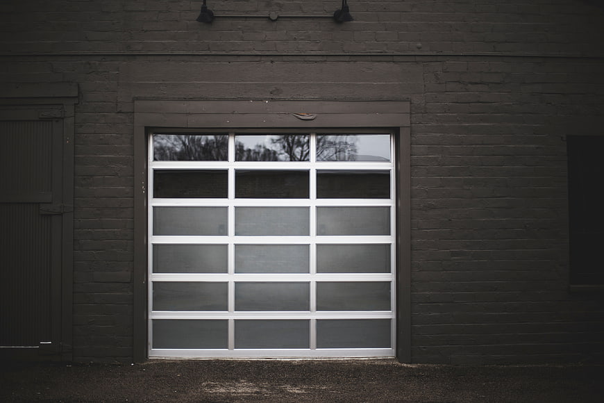 Modern Garage Door on Dark Brick Wall