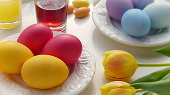 Colorful Easter Eggs and Tulips on White Table
