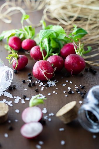 Fresh Red Radishes with Salt and Pepper on Wooden Table