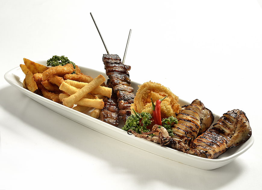 Grilled Meat And Seafood Platter With Fries On White Background