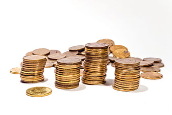 Stacks of gold coins on white background