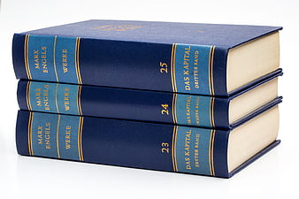 Stack of three blue Marx Engels Werke books on white background