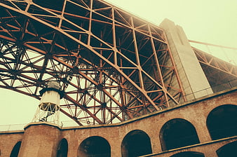 Low angle view of steel bridge truss and brick arches
