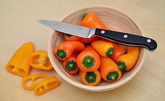 Orange Mini Peppers in Wooden Bowl with Knife